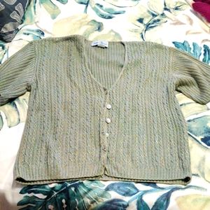Pretty pale green sweater.